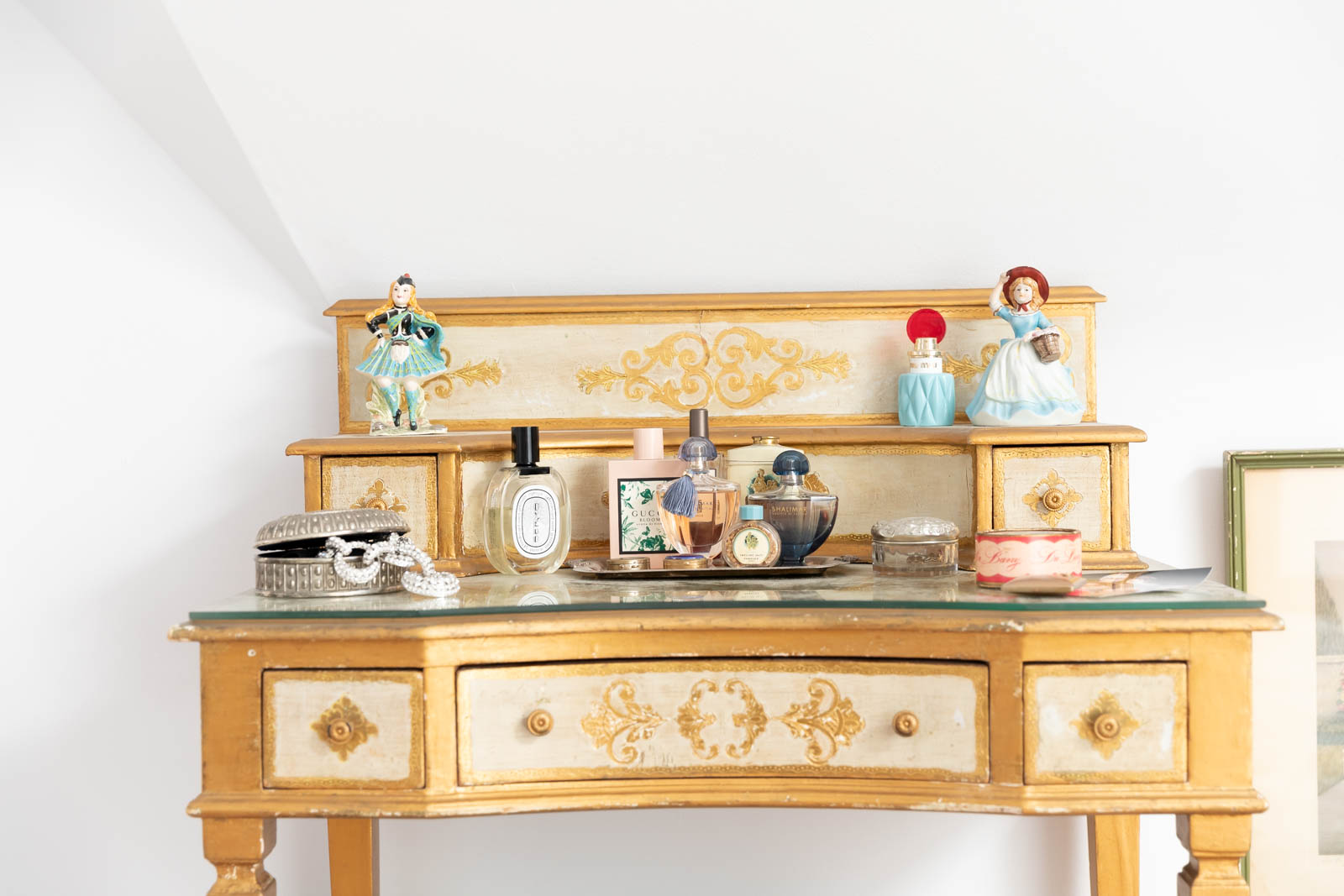 A gold vanity Florentine desk in the master bedroom