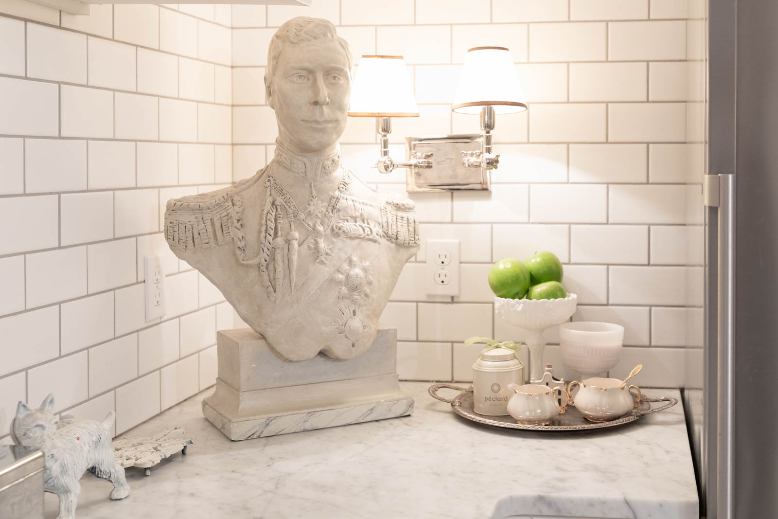A bust of King George VI appears in the basement kitchen