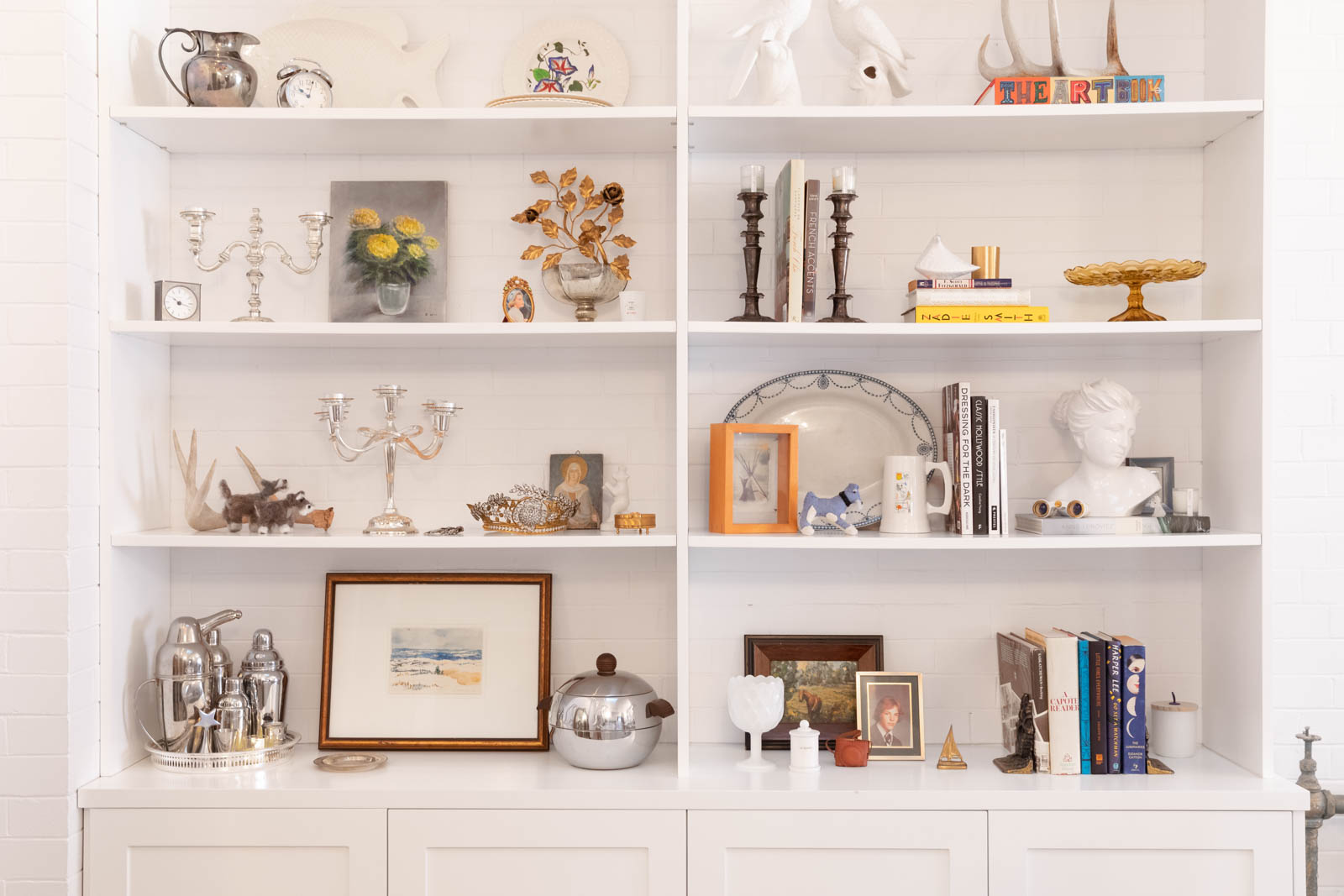 A custom-built shelving unit with a variety of knick-knacks