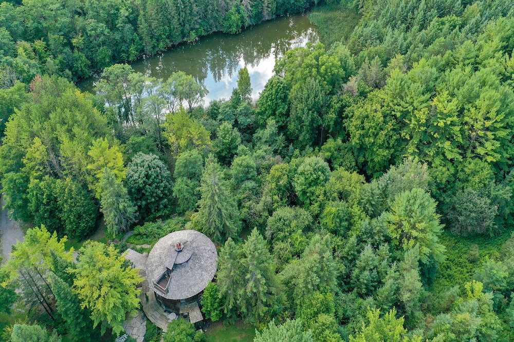 circle-shaped home near river