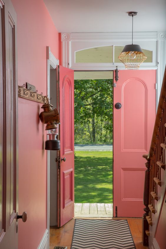 Farmhouse with pink front doors