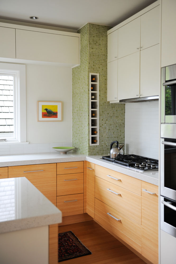 Kitchen with wine storage in green mosaic tile stack