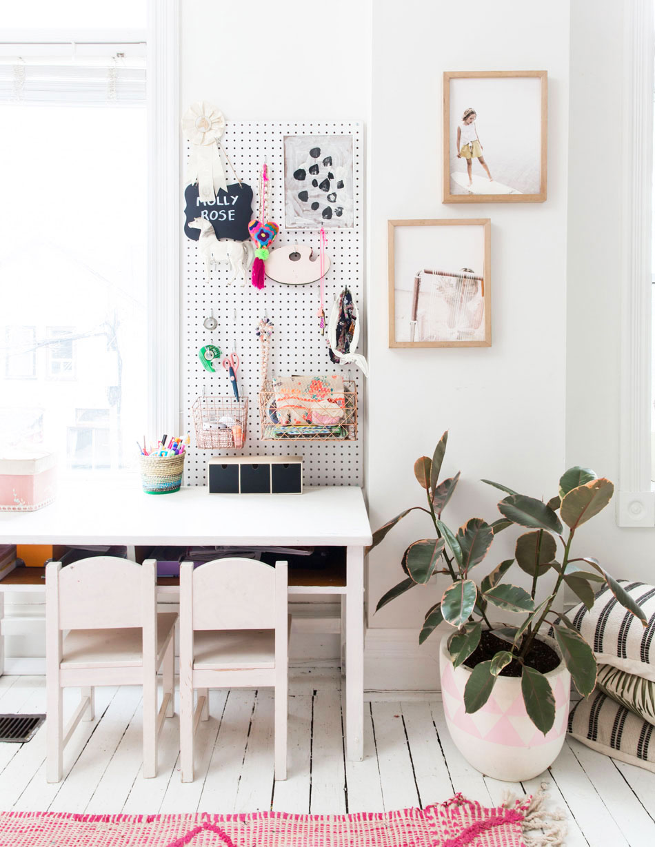 Stylish pink and white kids' craft and homework space.