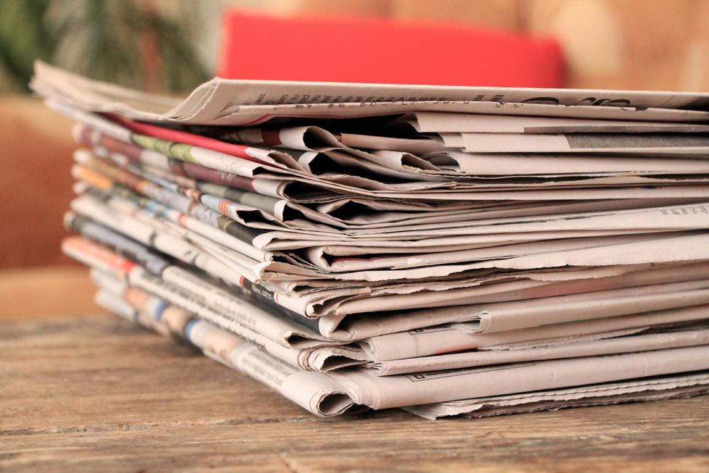 Stack of newspapers on a table