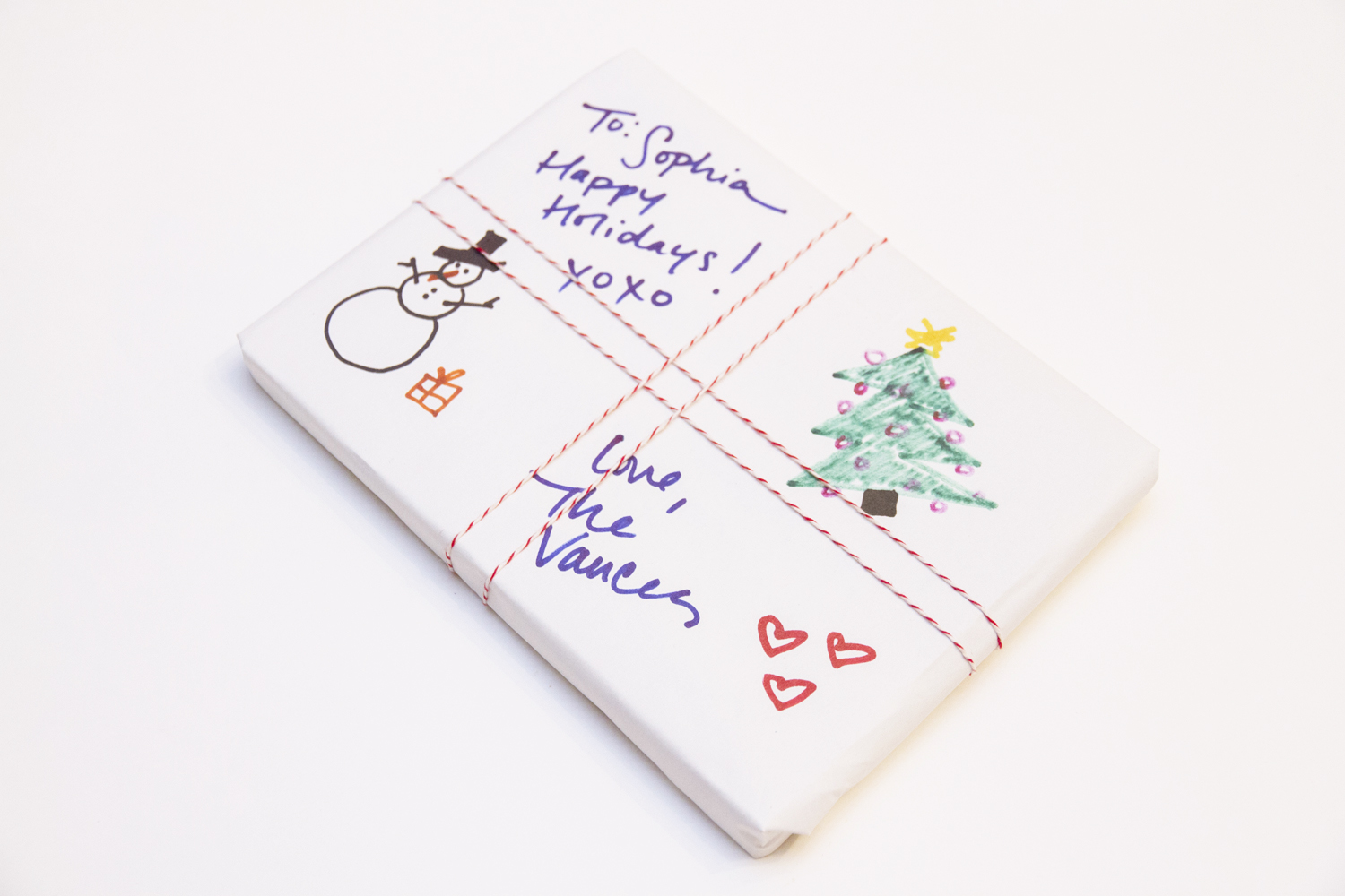 Present wrapped in white paper with hand written message
