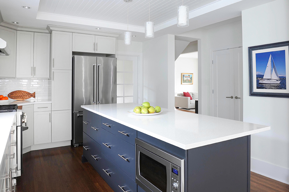 Modern white kitchen with large gunmetal blue island