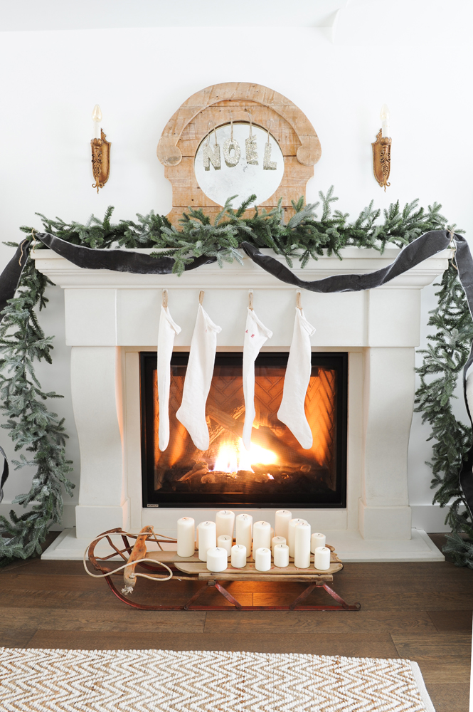 Vintage-inspired fireplace with stockings and garland