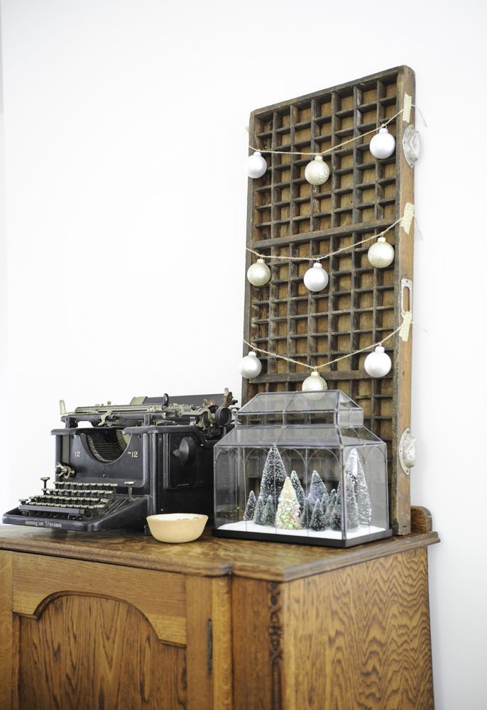 antique typewriter, tray on wall and terrarium