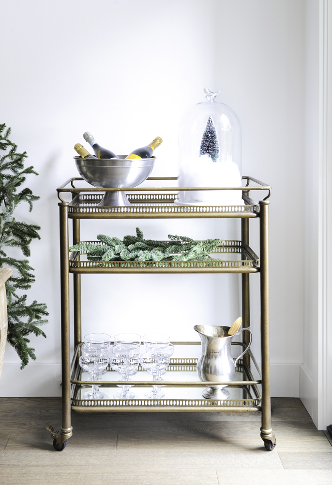 Brass bar cart dressed up with festive additions.
