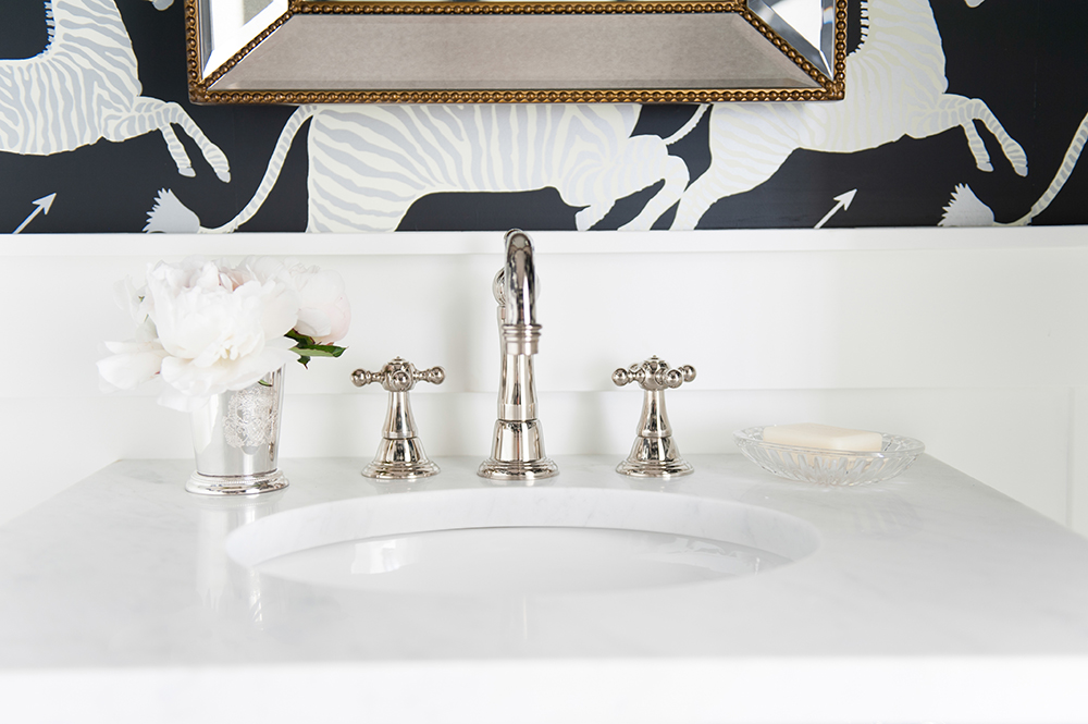 The sparkle of this bathroom's fixtures have a dazzling effect.