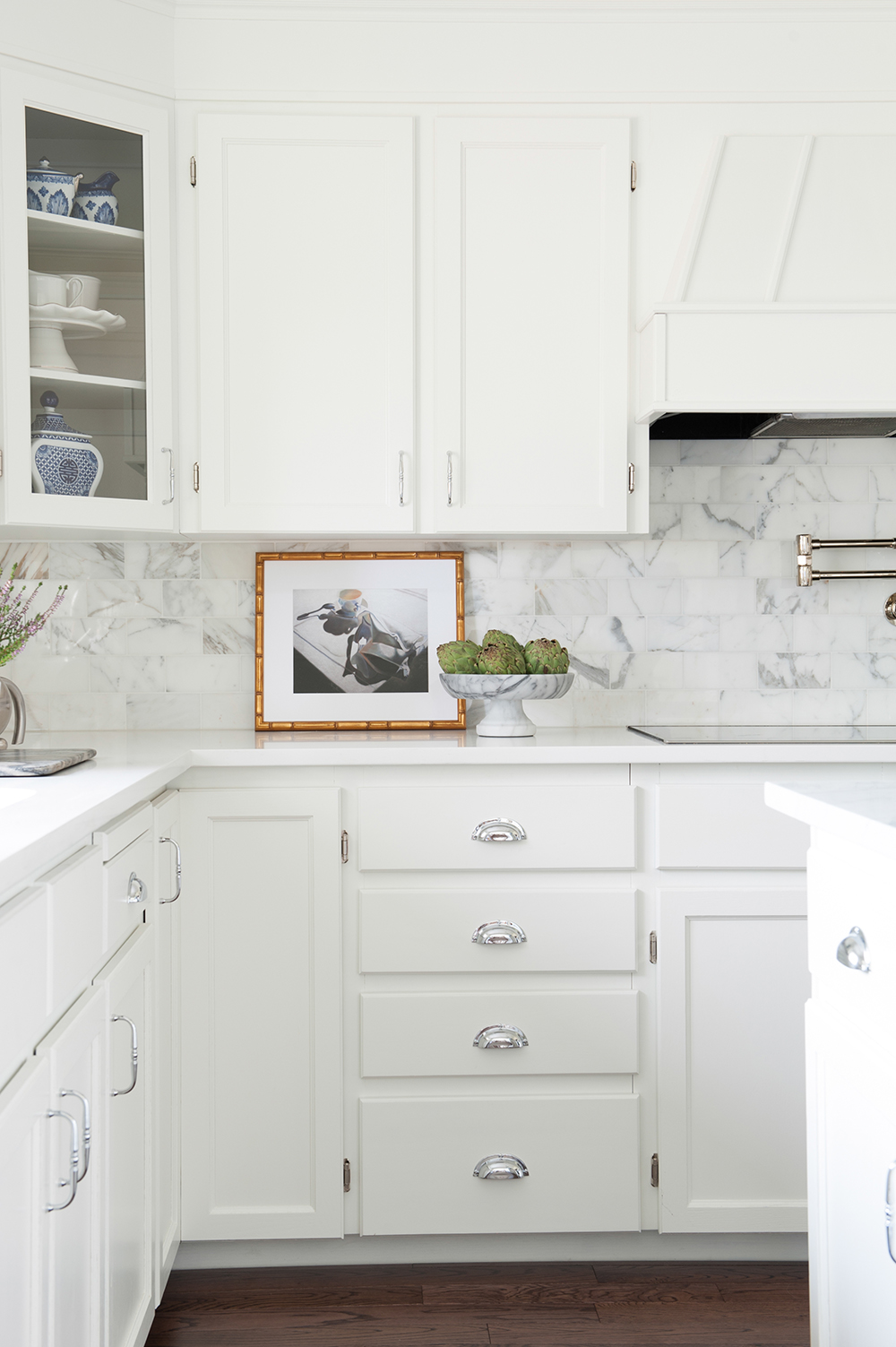 A modern-meets-traditional kitchen updated with white trim.