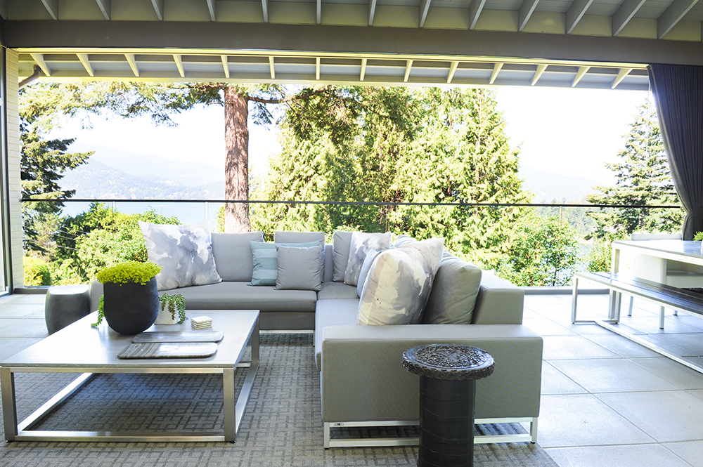 A scenic outdoor space with neutral furnishings.
