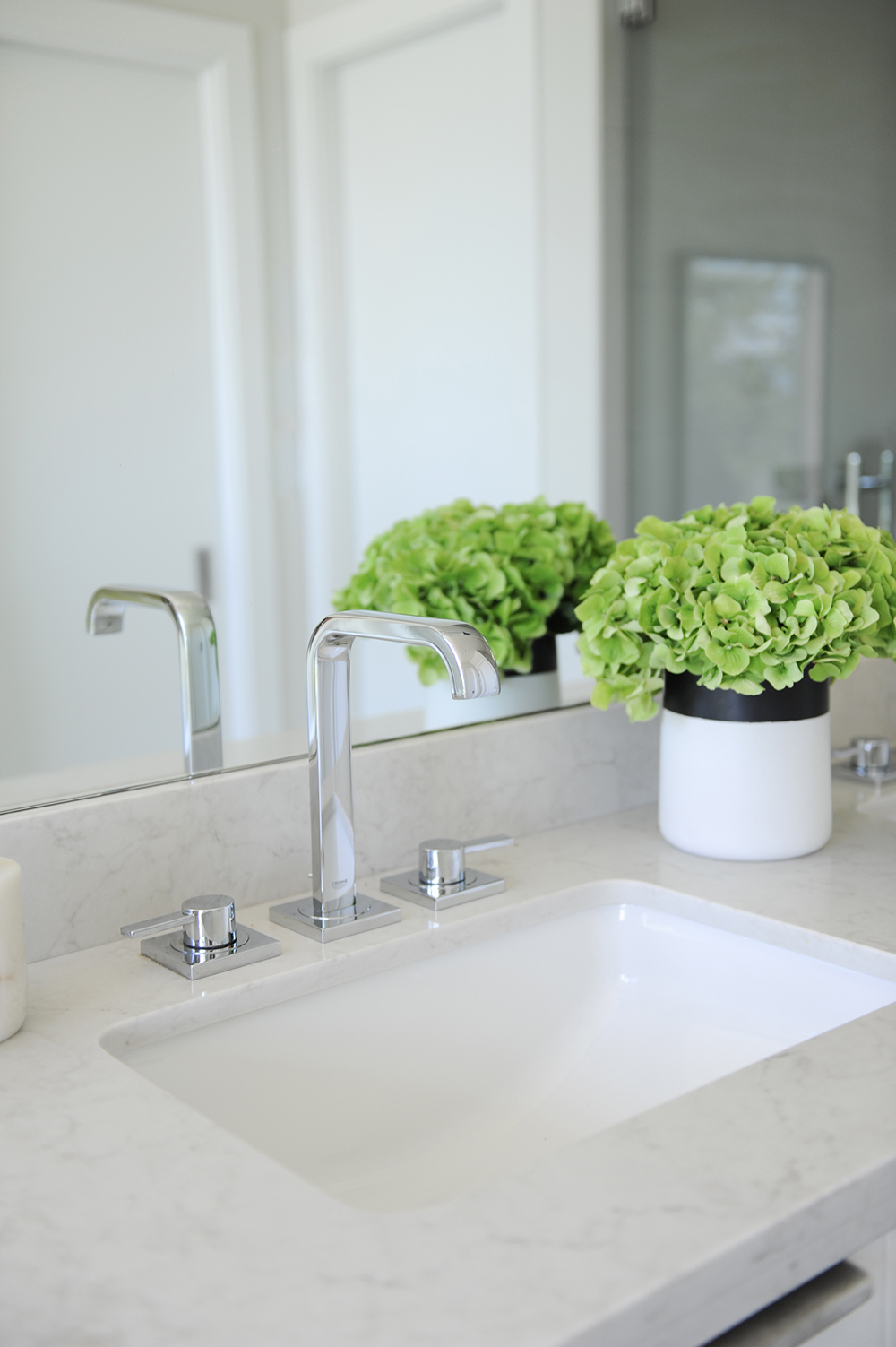A light-filled ensuite with undermount sinks.