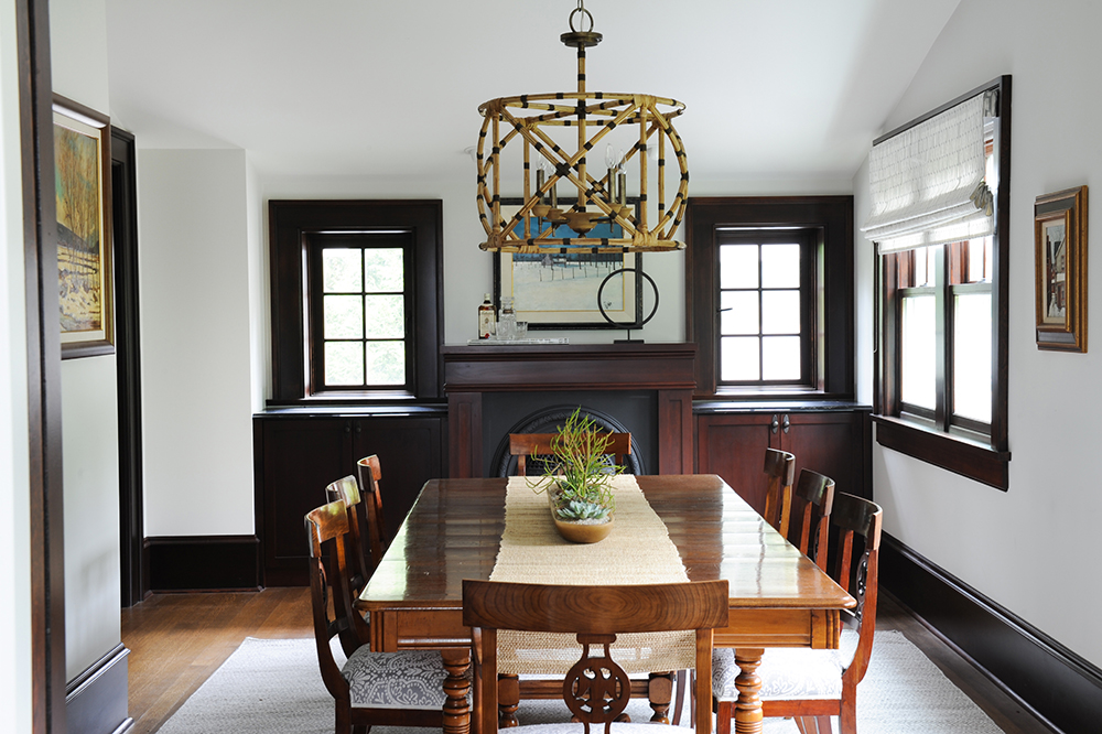 This dining room's lighter toned table and chairs are antique finds.