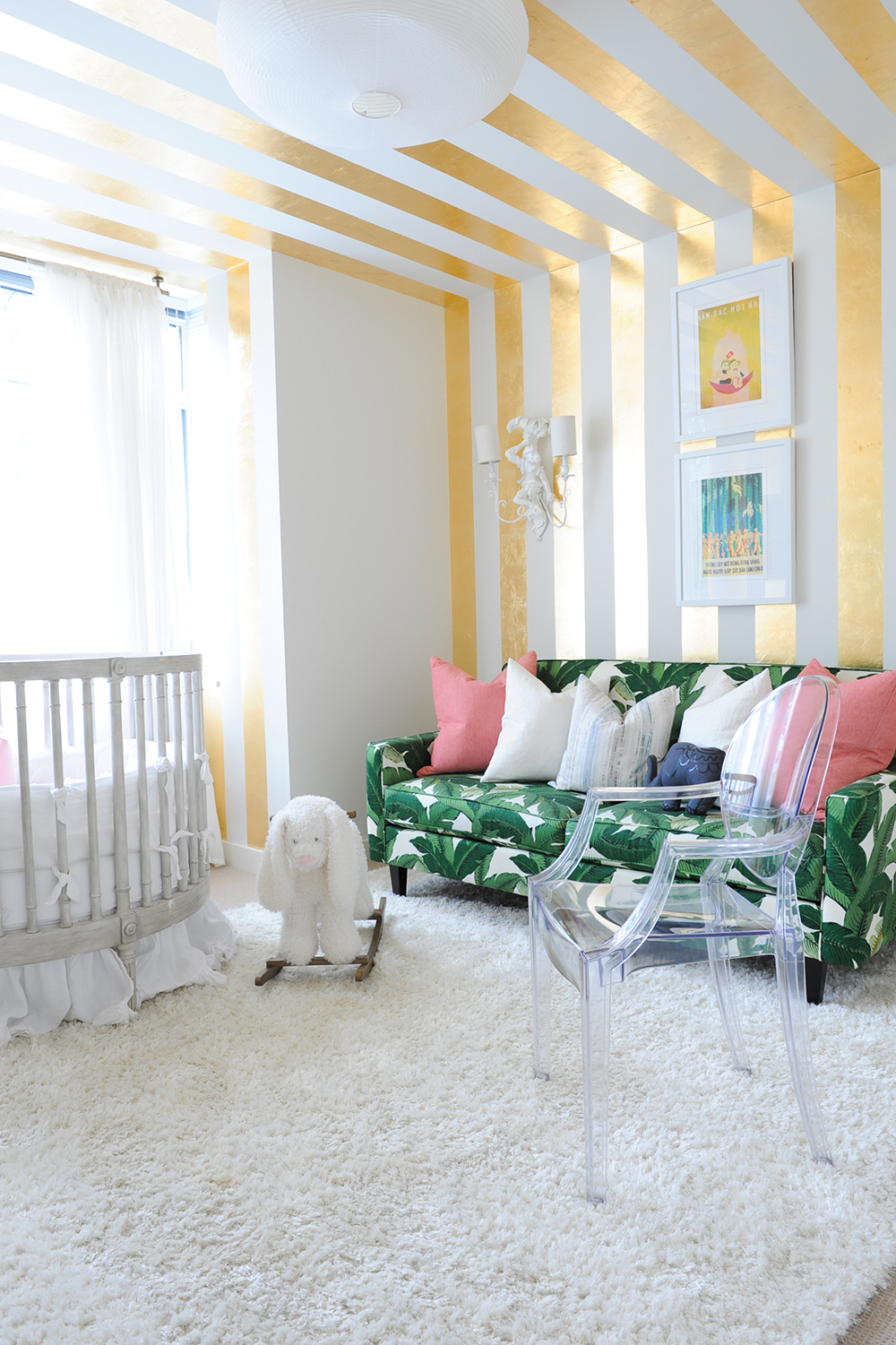 A stylish nursery featuring stripes of gold leaf.
