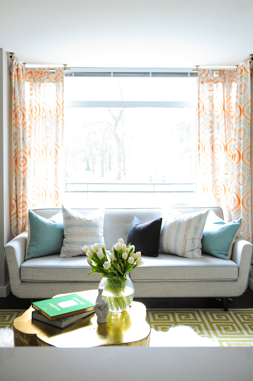 A bright and glam living space with bold hits of pattern.