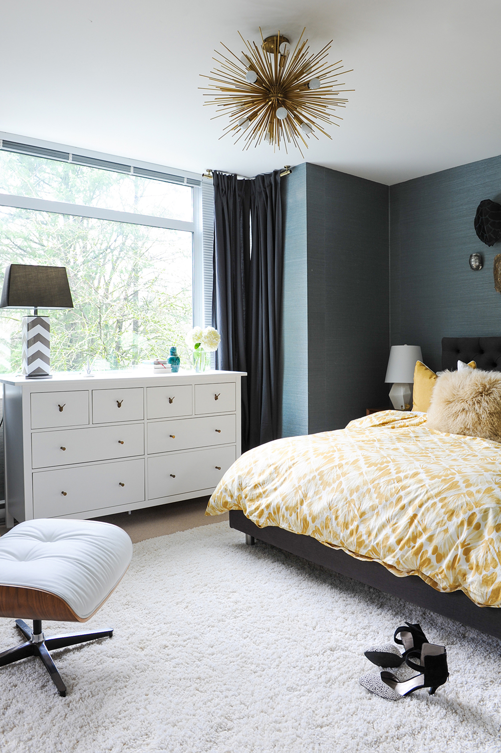 A dark and moody master bedroom with playful touches.