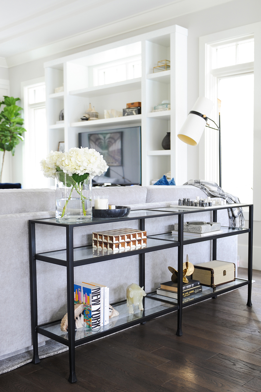 A simple black console table dressed up with artful accessories.