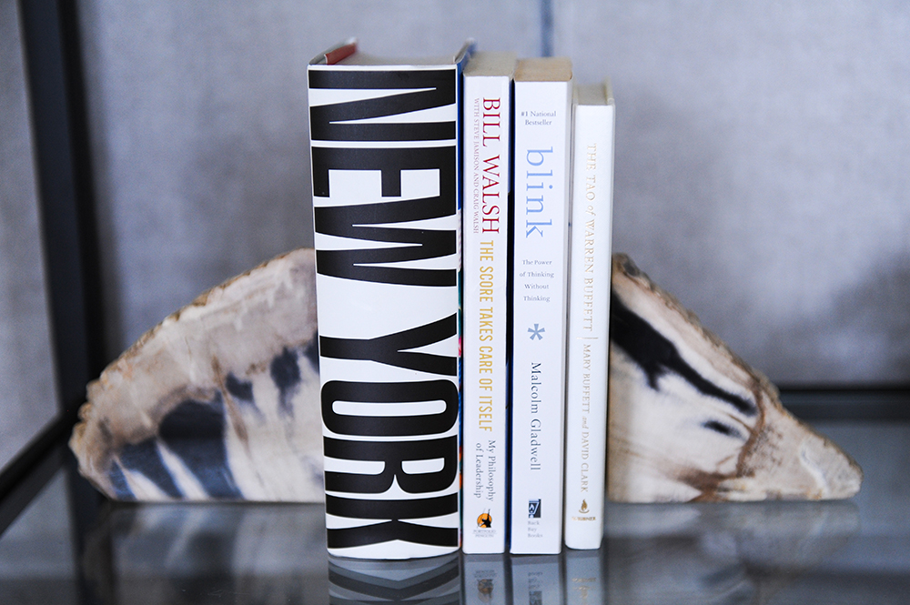 Books placed between stylish stone bookends.