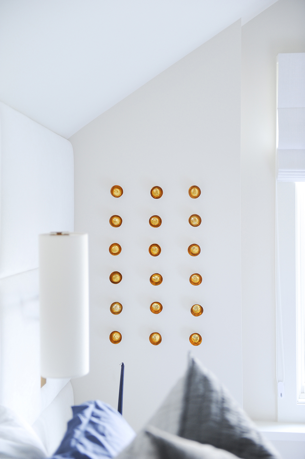 Small gold wall decals add a different medium of art into the mix.