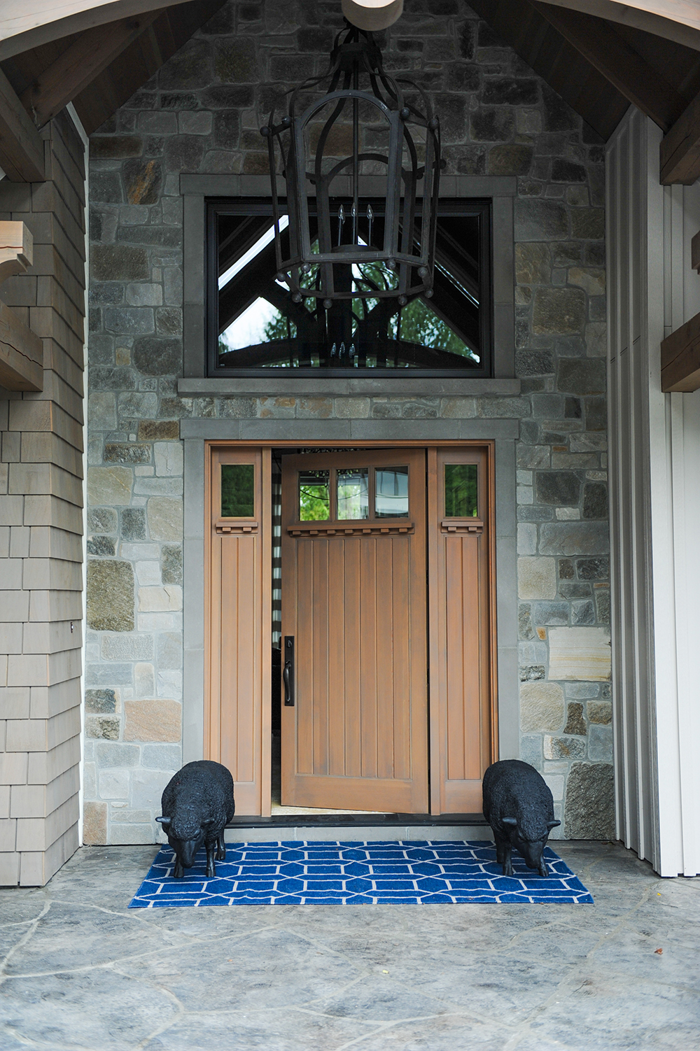 Homeowner Chris Meyer chose the grey-stained solid wood front door