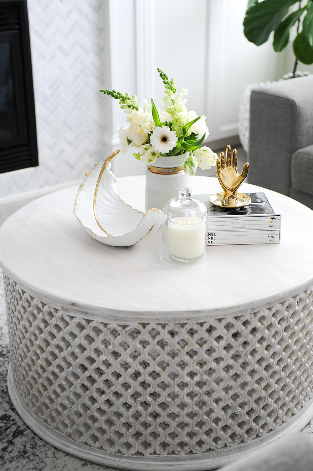Round Noor coffee table with a delicate fretwork base.