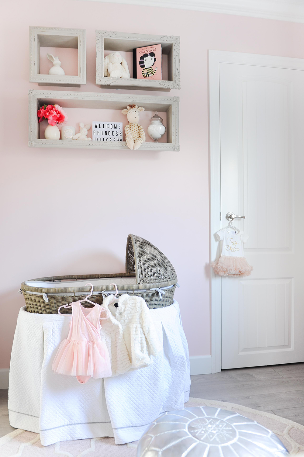 A vintage-look woven bassinet adds a dream-like quality to this sweet nursery.