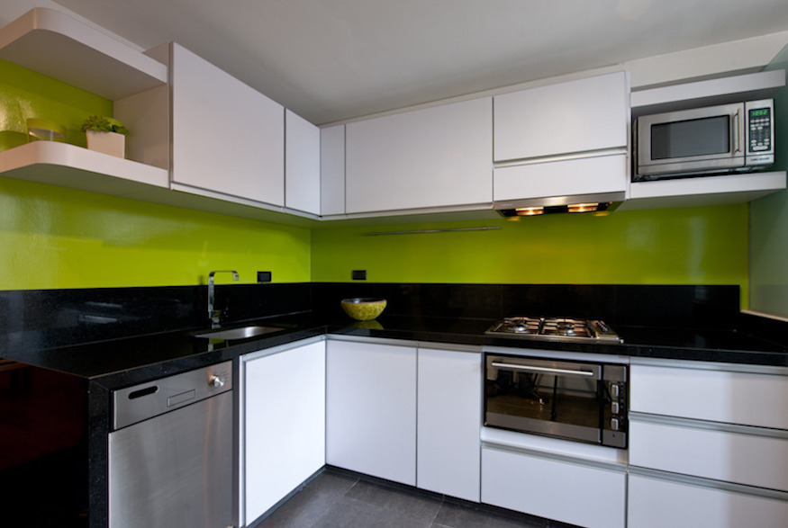 Bright green walls in modern-style kitchen