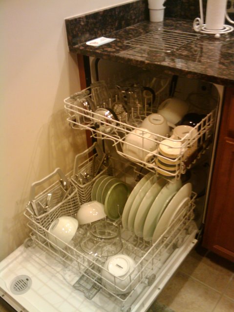 Half-empty dishwasher in a kitchen