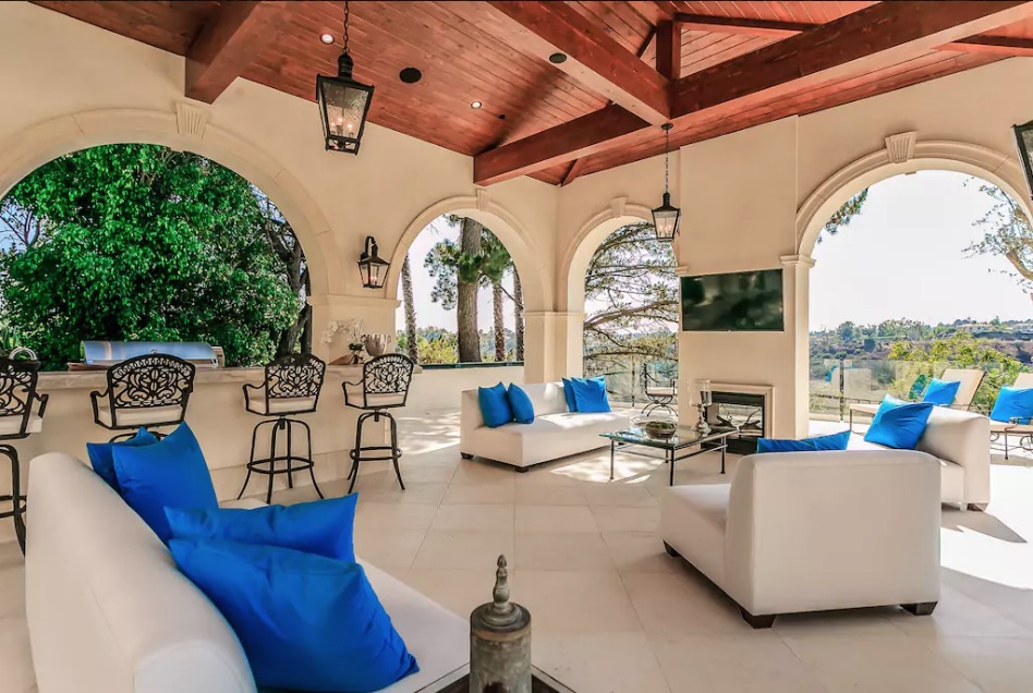 Outdoor lounge in Airbnb mansion rented by Drake