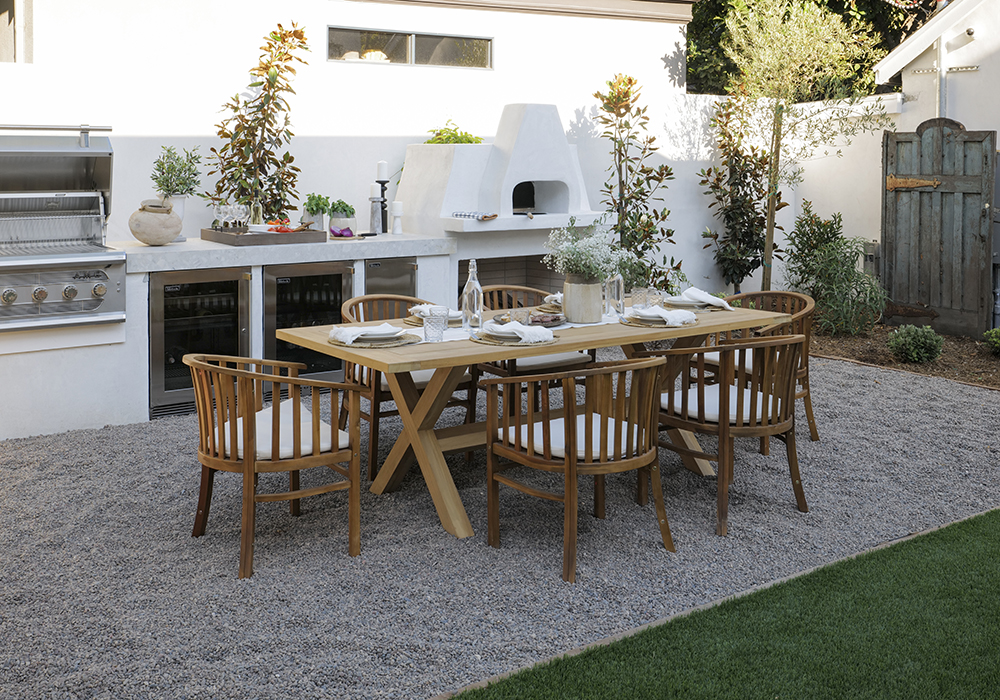 An outdoor kitchen and dining room