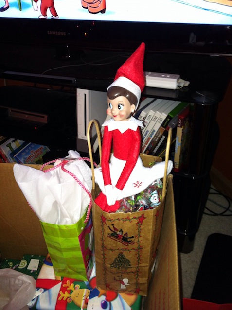Elf on the Shelf tucked in a gift bag
