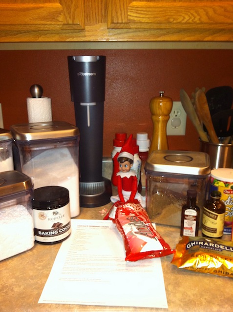 Elf on the shelf baking in the kitchen