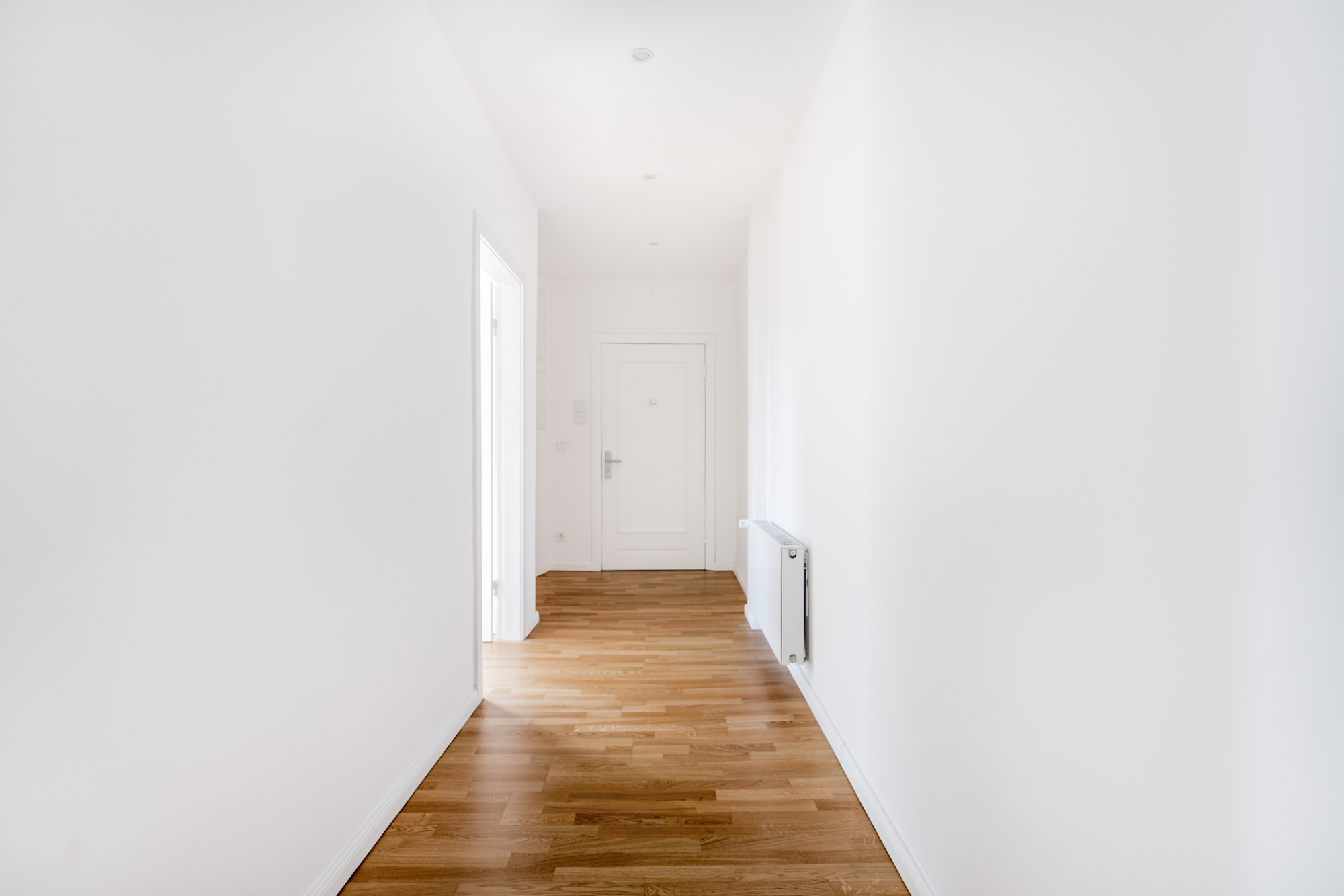 empty hallway with bare white walls