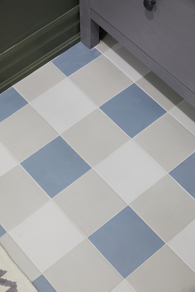 bathroom floor tile in blue, white and grey buffalo check pattern