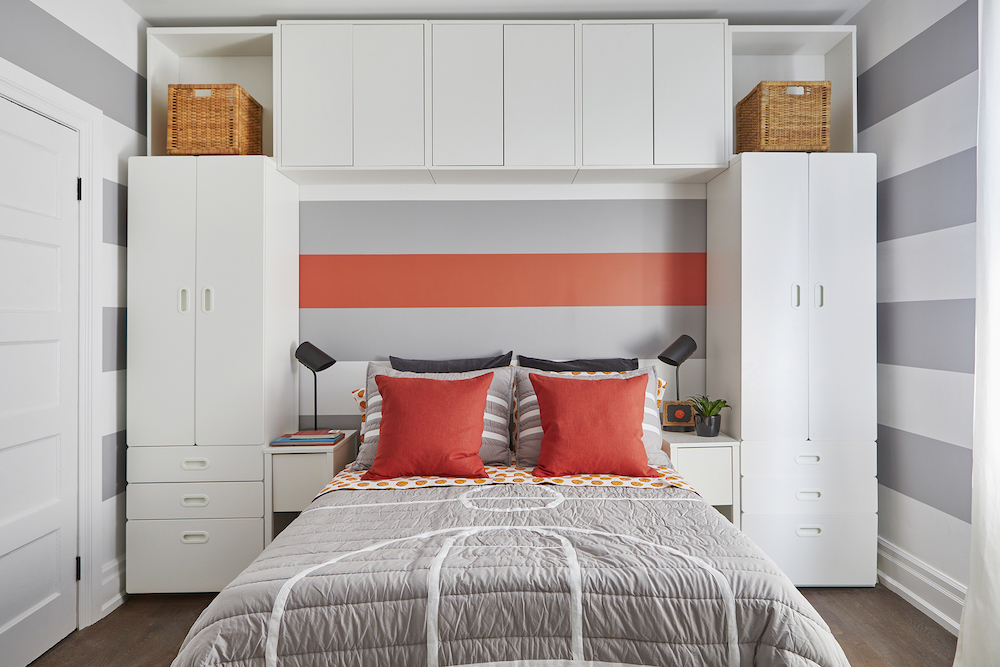 grey-and-white striped room with white storage and grey bed