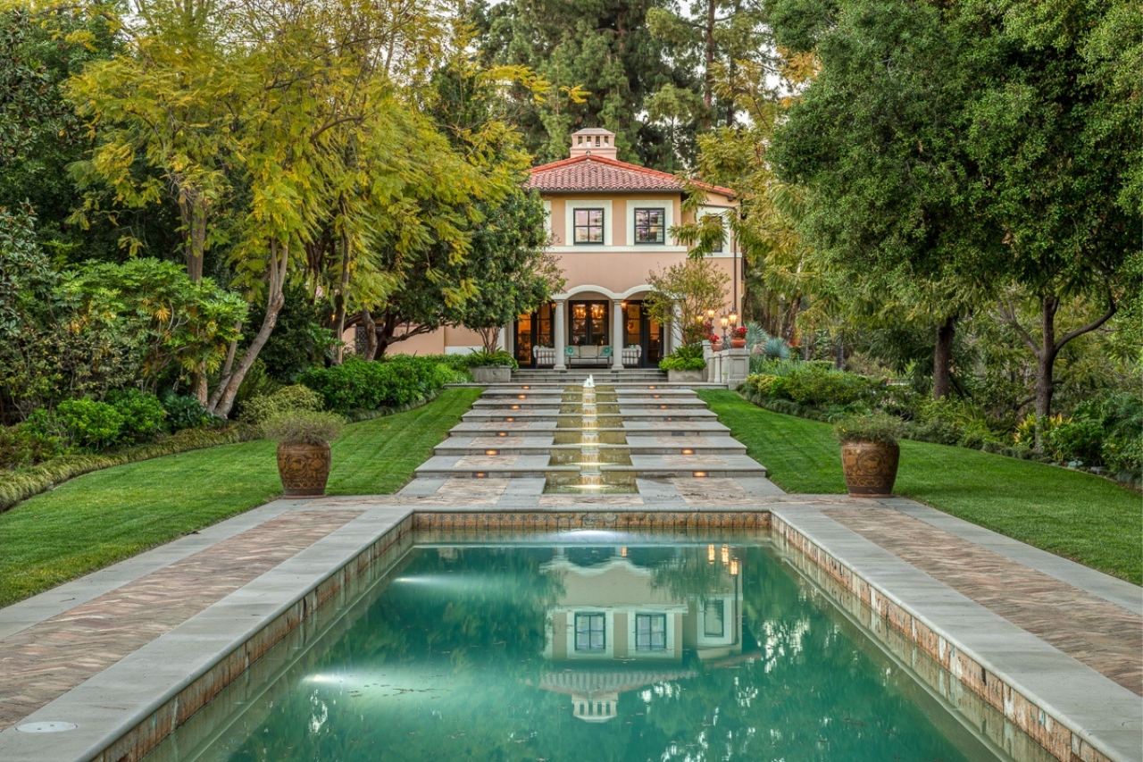 A lap pool in front of a Pasadena mansion