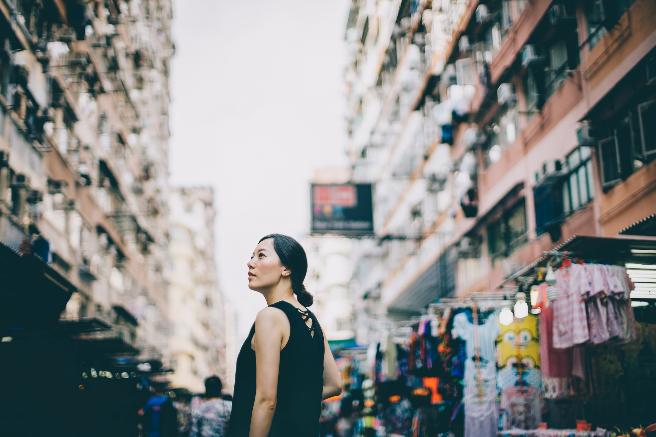 Woman wandering through an urban centre.