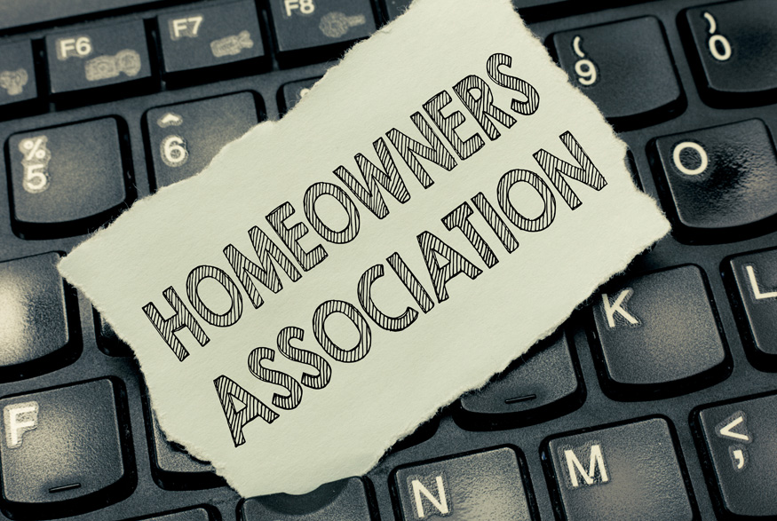 Homeowners Association written on paper resting on a keyboard