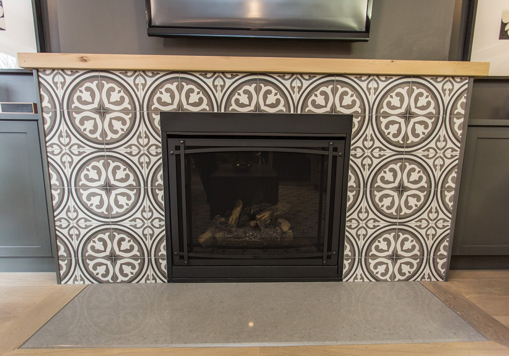 A fireplace surrounded by tiles