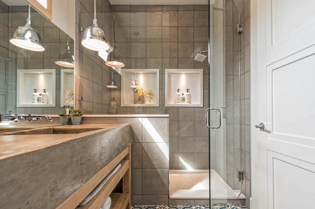 Walk-in shower in master bathroom of Fixer Upper Shotgun House
