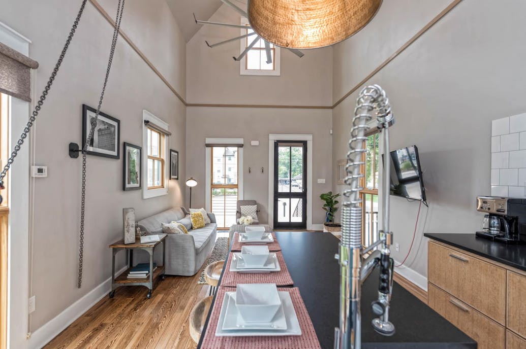 Open concept living room and kitchen in Fixer Upper Shotgun House