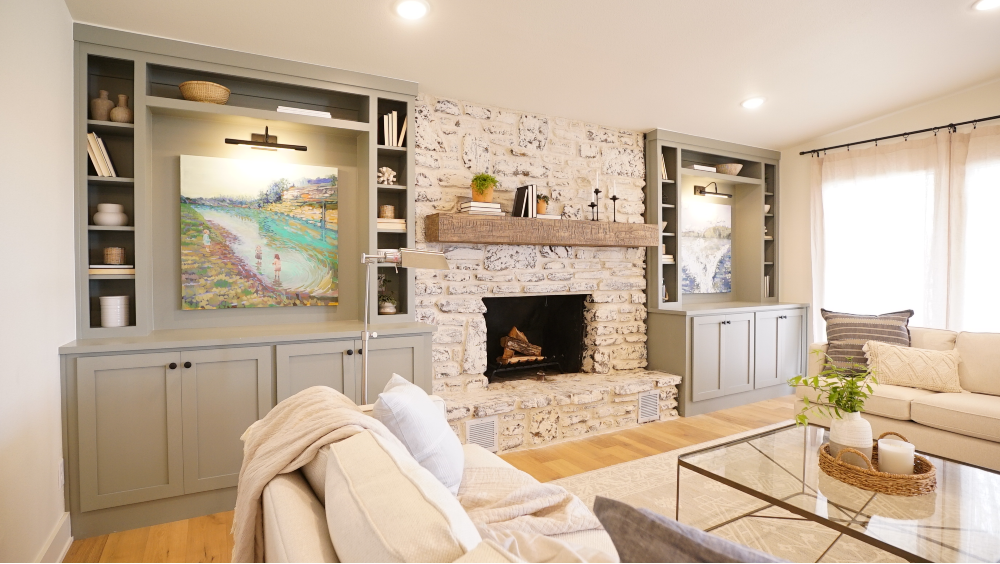 Neutral living room with white stone fireplace