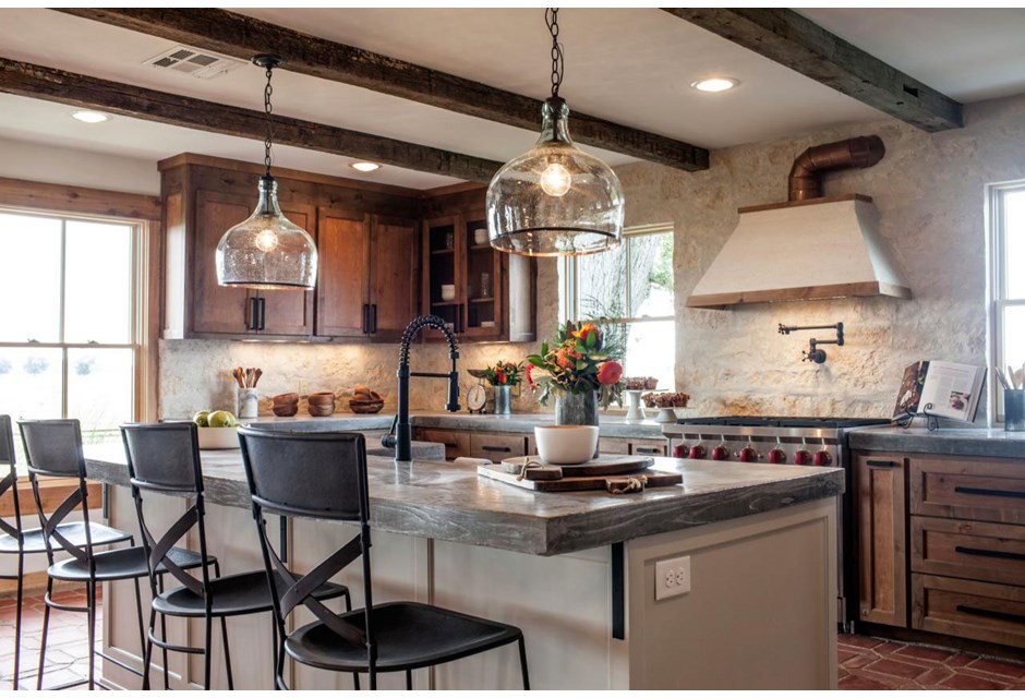 The gorgeous exposed wood on the ceiling draws the eye and creates a barn-like feel. Meanwhile the modern fixtures and updated cabinetry bring the look into a modern era.