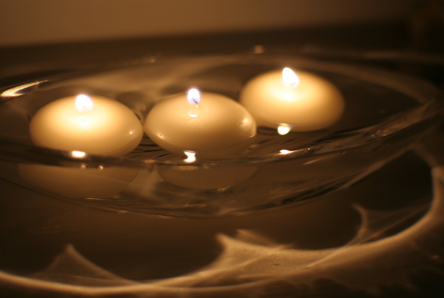 Close up shot of lit floating candles