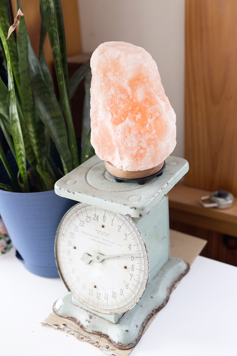 Salt lamp on top of vintage scale