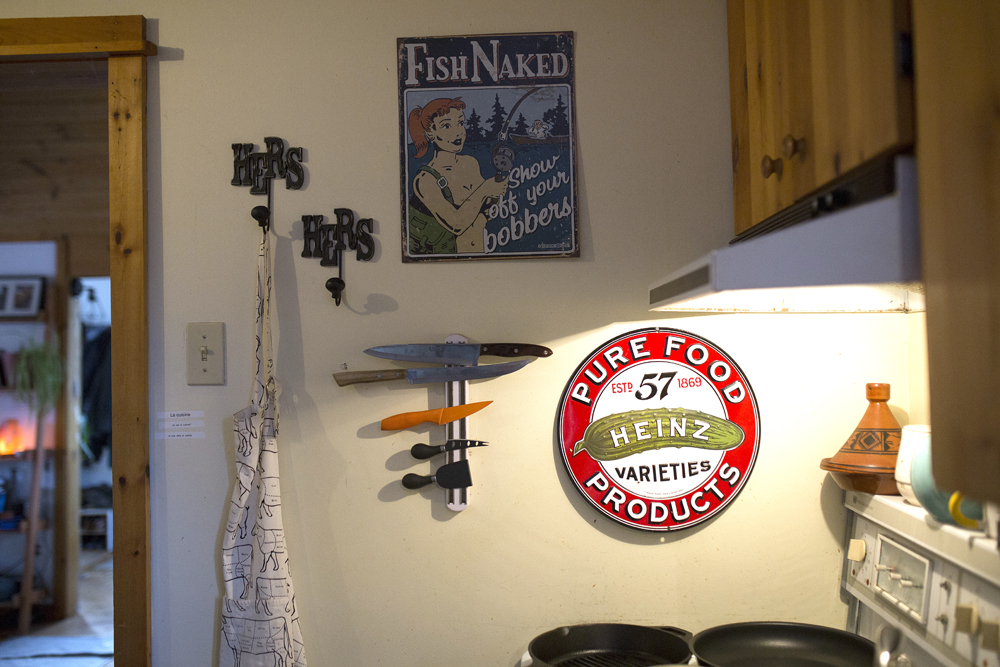 Kitchen with a variety of knick knacks on the wall