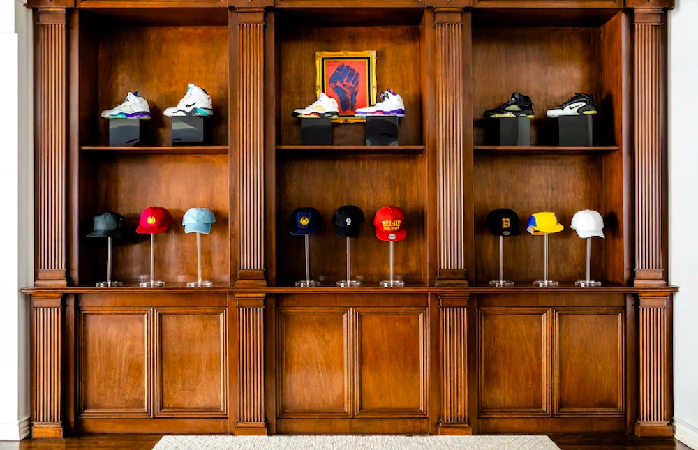 Sneakers and hats on display in Fresh Prince mansion