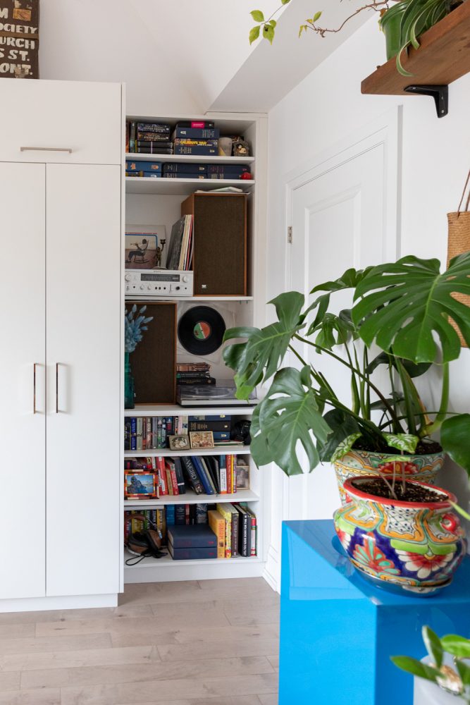 white bedroom shelving with record player