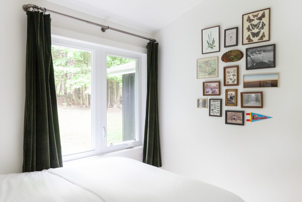 White bedroom with gallery wall